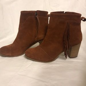 Rust color Toms suede ankle booties with fringe